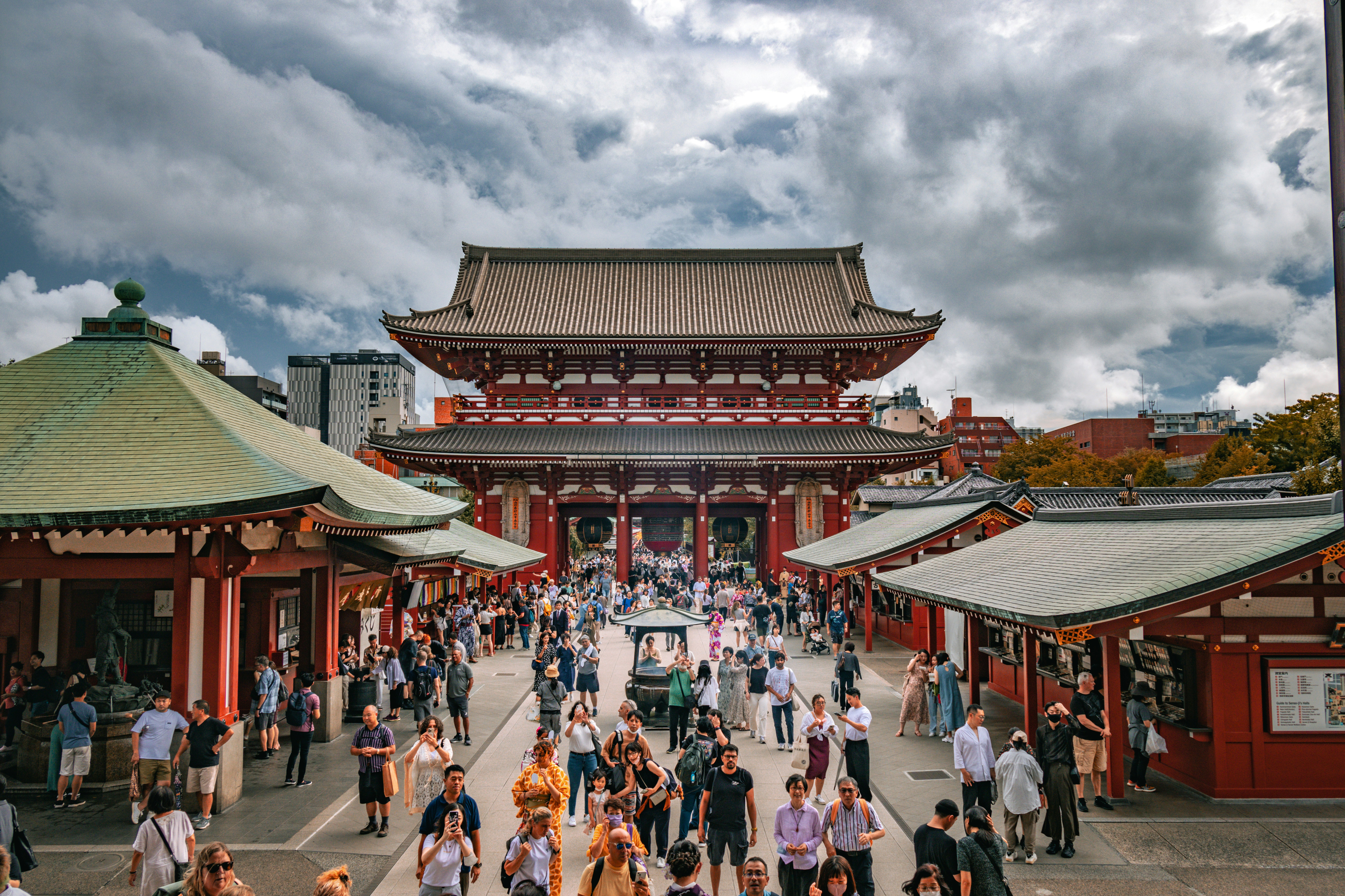Red Kaminarimon gate of Senso-ji Temple with large lantern and crowds of visitors